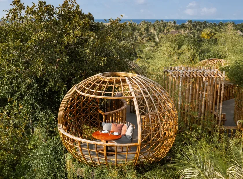 Elevated bamboo dining pod at Terra restaurant at Waldorf Astoria Maldives Ithaafushi