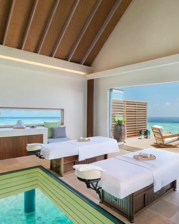 Luxury overwater spa treatment room at Waldorf Astoria Maldives Ithaafushi