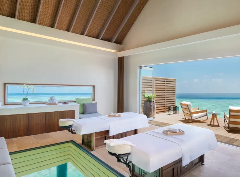 Luxury overwater spa treatment room at Waldorf Astoria Maldives Ithaafushi