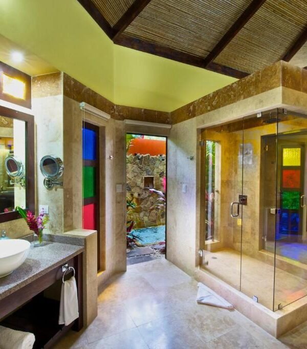 Luxury bathroom with rainforest shower at Nayara Gardens in Costa Rica