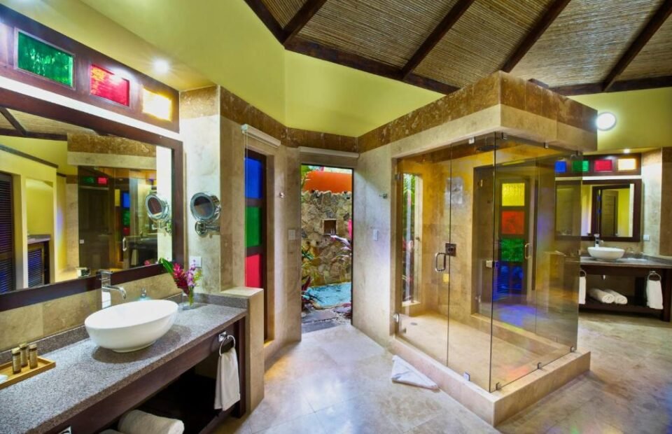 Luxury bathroom with rainforest shower at Nayara Gardens in Costa Rica