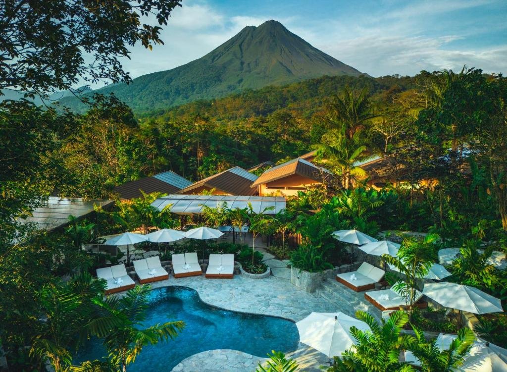 Infinity pool with Arenal Volcano views at Nayara Gardens luxury resort in Costa Rica