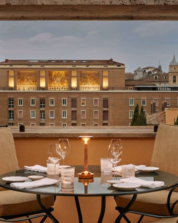 Rooftop terrace dining at Bulgari Hotel Roma overlooking the historic Rome skyline