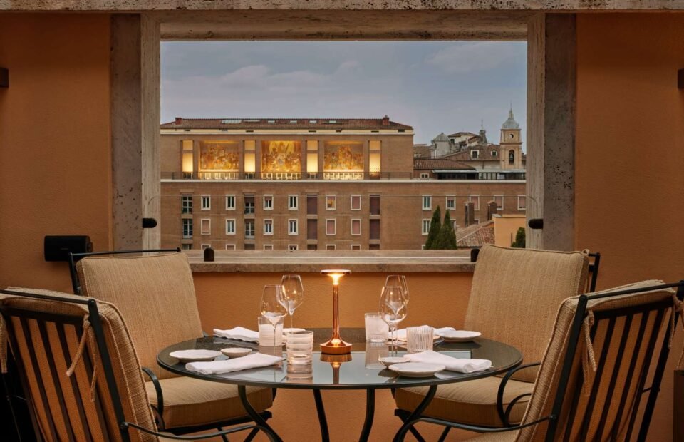 Rooftop terrace dining at Bulgari Hotel Roma overlooking the historic Rome skyline