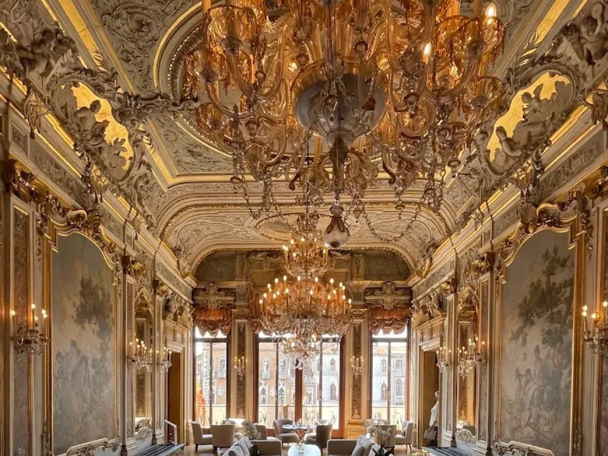Frescoed grand salon with chandeliers and lounge seating