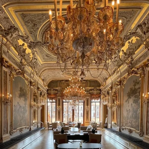 Frescoed grand salon with chandeliers and lounge seating