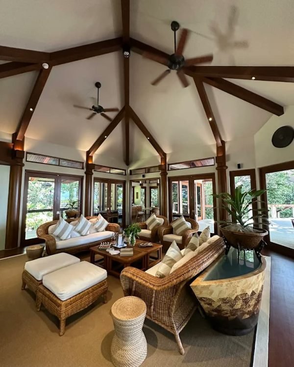 Vaulted villa living pavilion with rattan seating and garden light