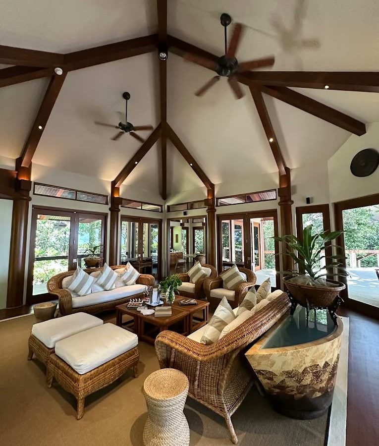 Vaulted villa living pavilion with rattan seating and garden light