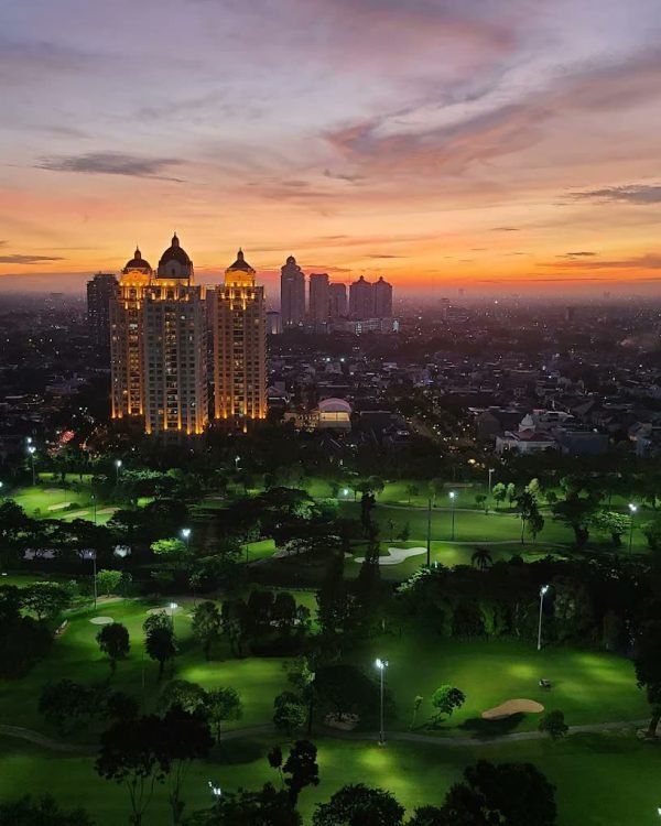 Sunset over the Senayan golf course and city towers from Fairmont Jakarta