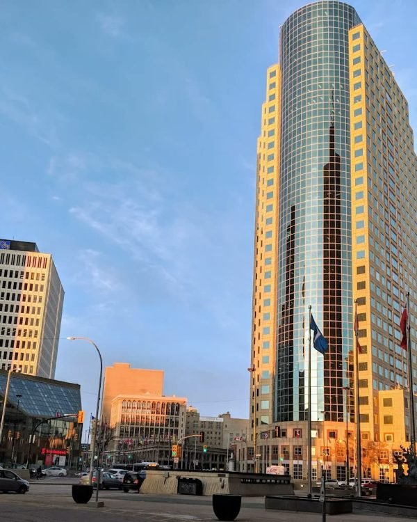 Golden evening light on the towers at Portage and Main outside Fairmont Winnipeg