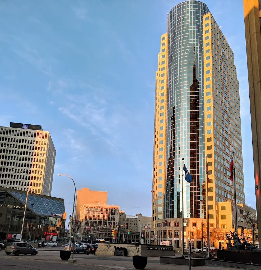 Golden evening light on the towers at Portage and Main outside Fairmont Winnipeg