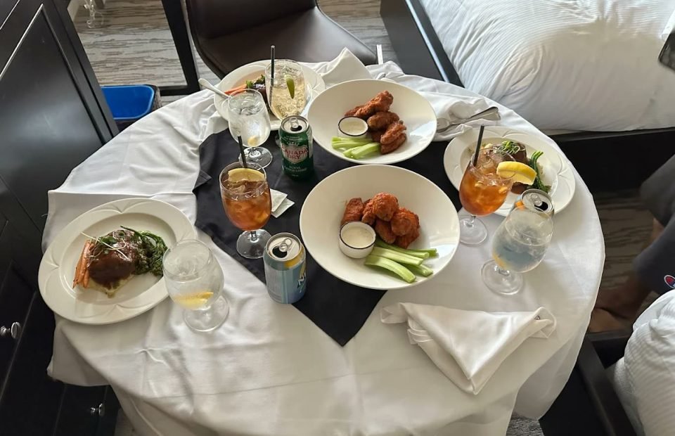 Room-service table set beside the bed at Fairmont Winnipeg