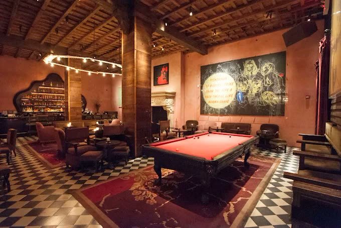 Billiards table under festoon lights in the bar at the Gramercy Hotel New York