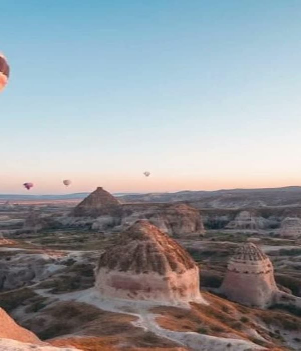 Hot air balloons above the fairy chimney valleys of Cappadocia at dawn