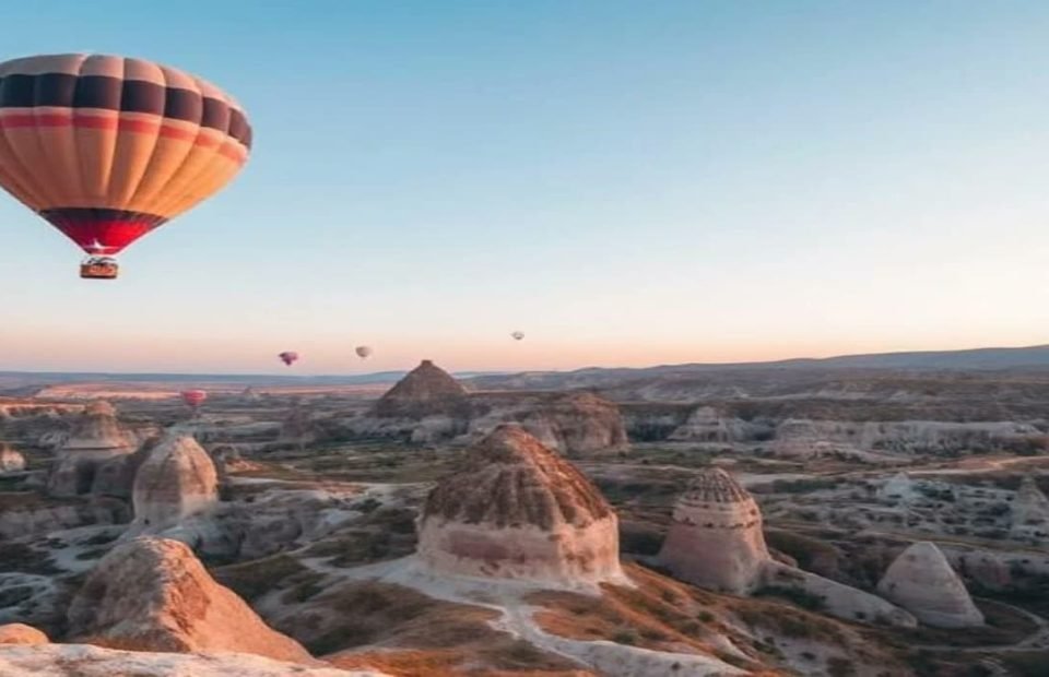 Hot air balloons above the fairy chimney valleys of Cappadocia at dawn