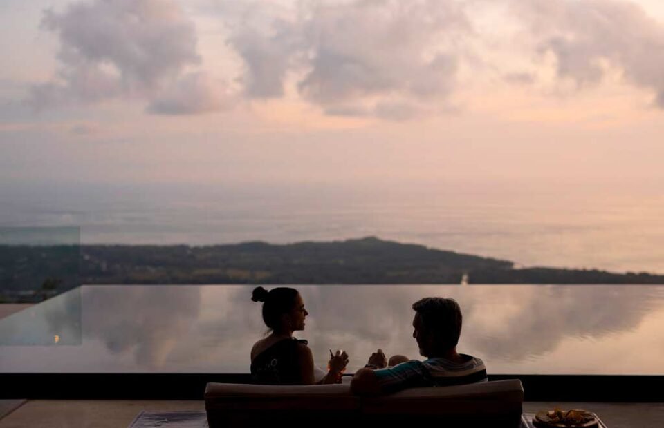 Infinity pool sunset view at Kura Costa Rica overlooking the Pacific Ocean