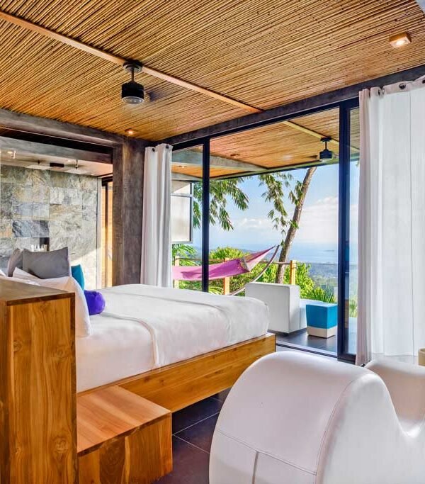 Luxury ocean view suite at Kura Costa Rica with floor-to-ceiling windows and private terrace