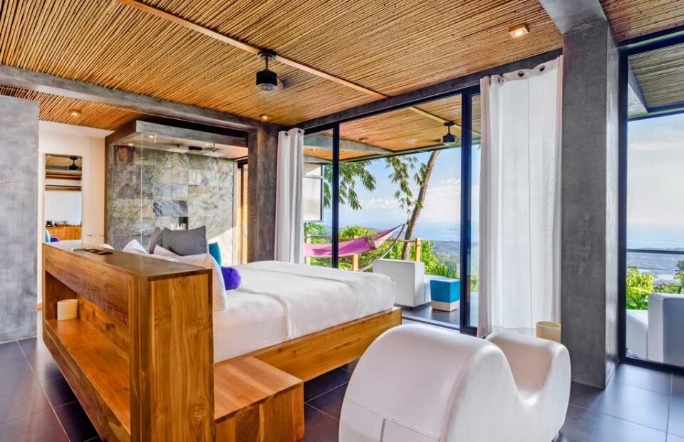 Luxury ocean view suite at Kura Costa Rica with floor-to-ceiling windows and private terrace