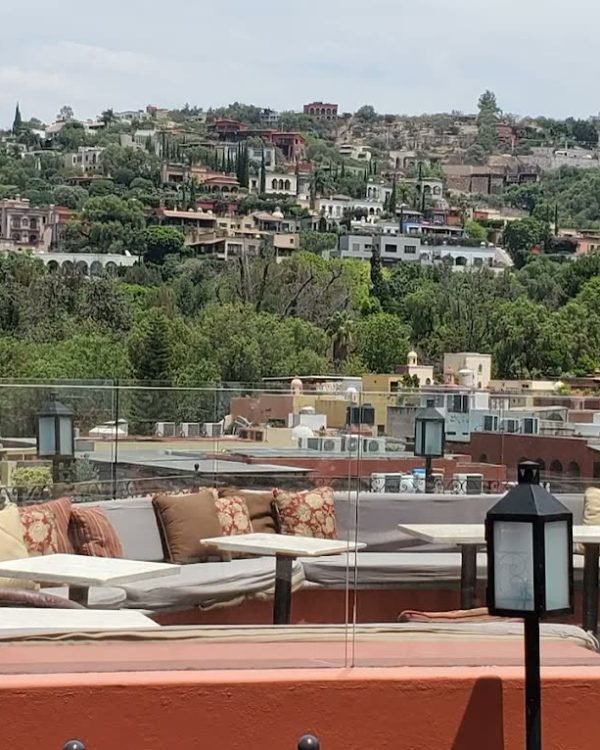 Rooftop terrace lounge in warm evening light