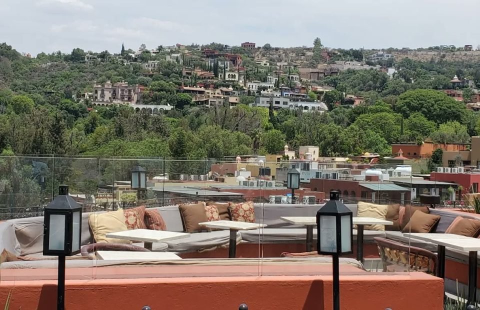 Rooftop terrace lounge in warm evening light