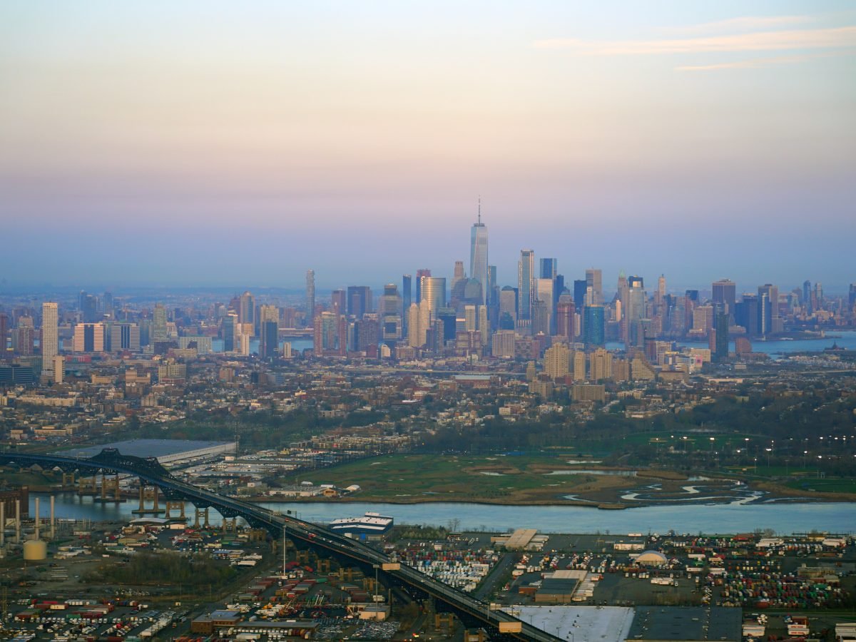 Pastel-haze aerial across Central Park to midtown Manhattan