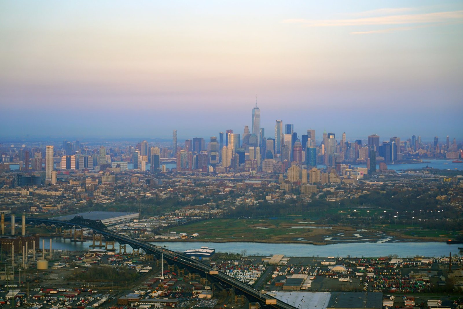 Pastel-haze aerial across Central Park to midtown Manhattan