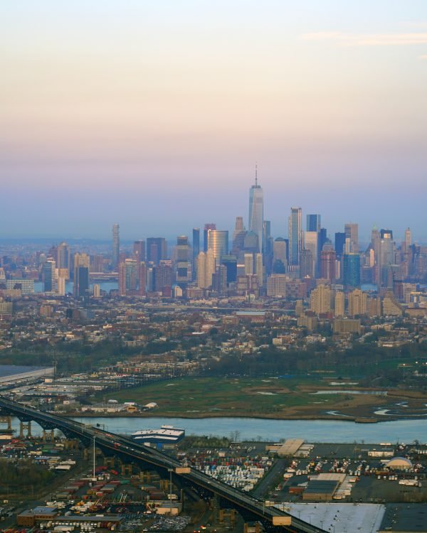 Pastel-haze aerial across Central Park to midtown Manhattan