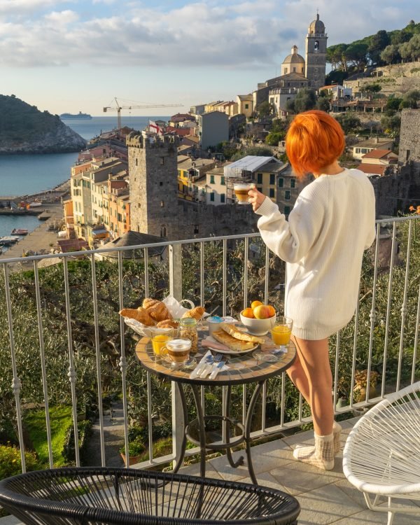 Balcony breakfast overlooking an Italian bay in the morning