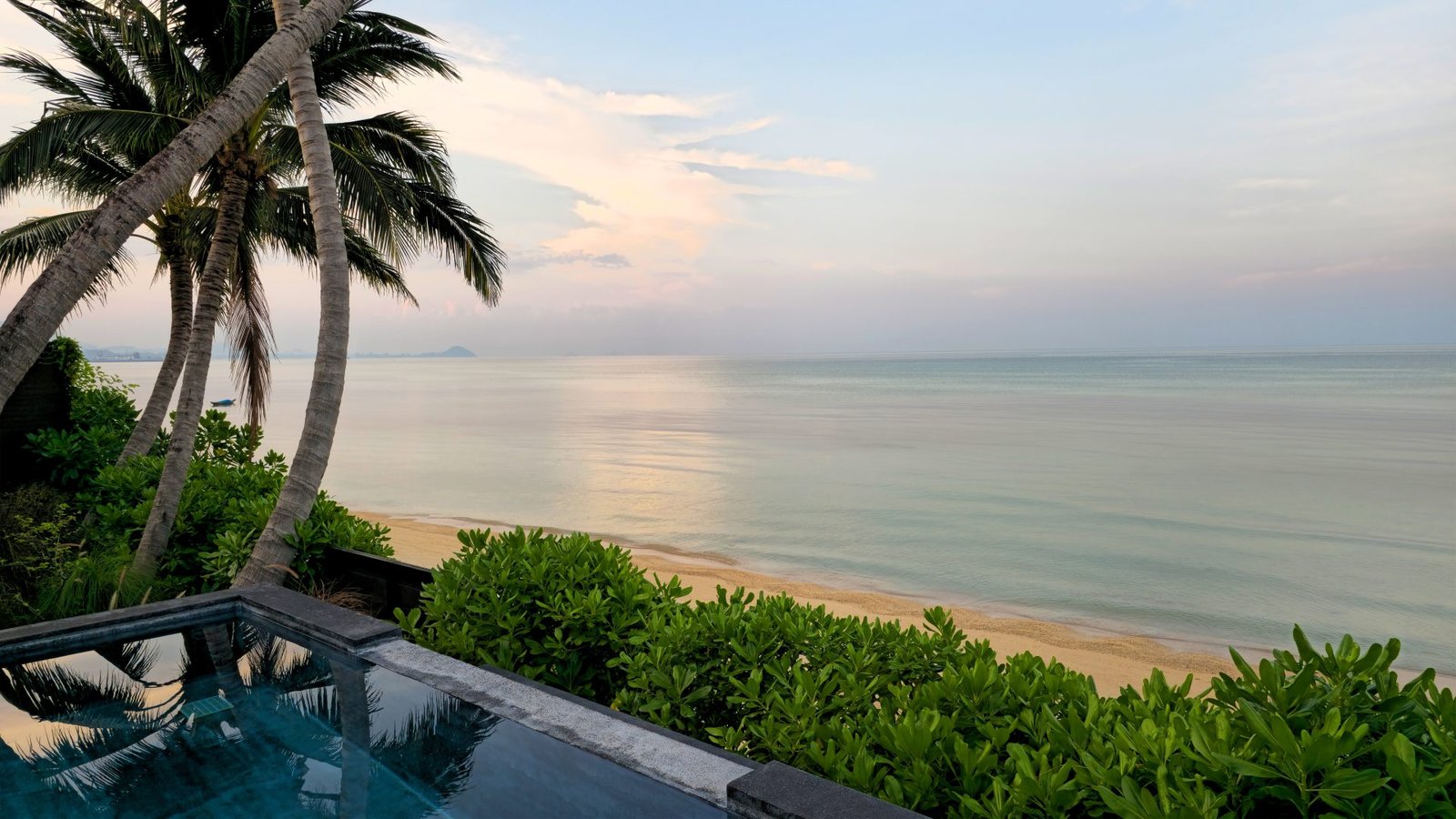 Clifftop plunge pool overlooking a pastel sea