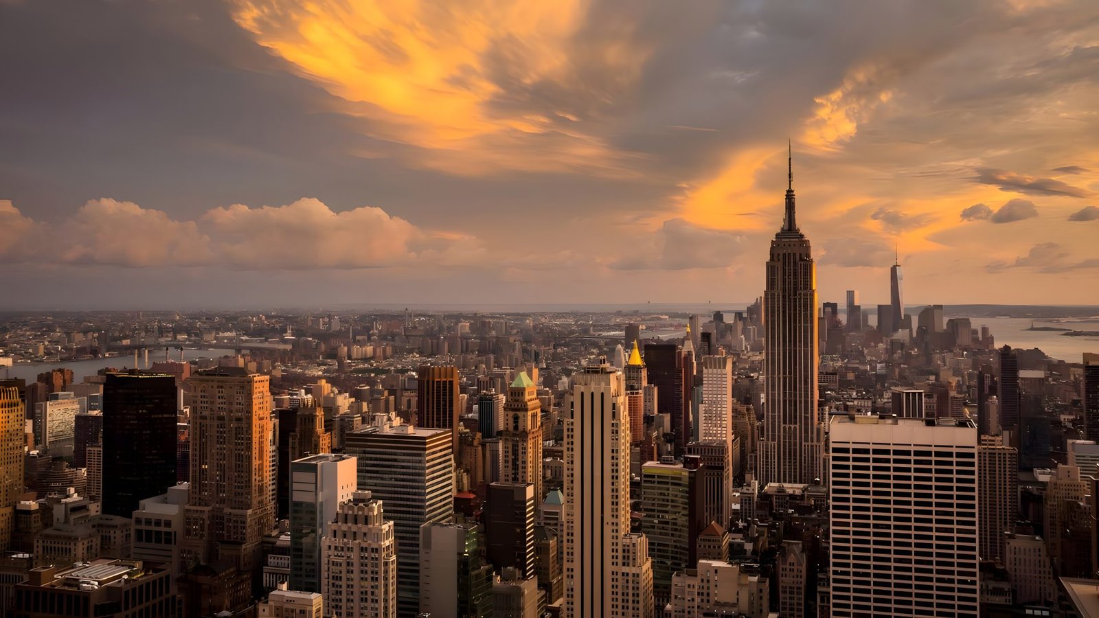 Empire State Building under golden-hour clouds over Manhattan