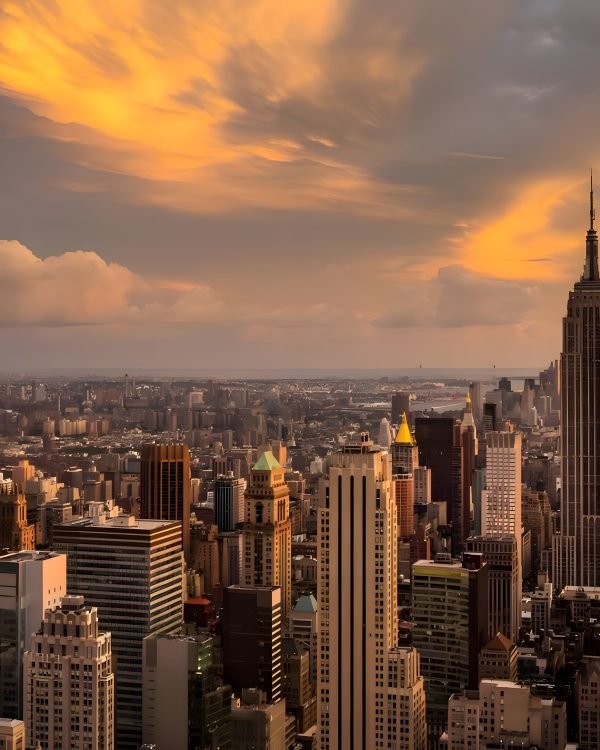 Empire State Building under golden-hour clouds over Manhattan