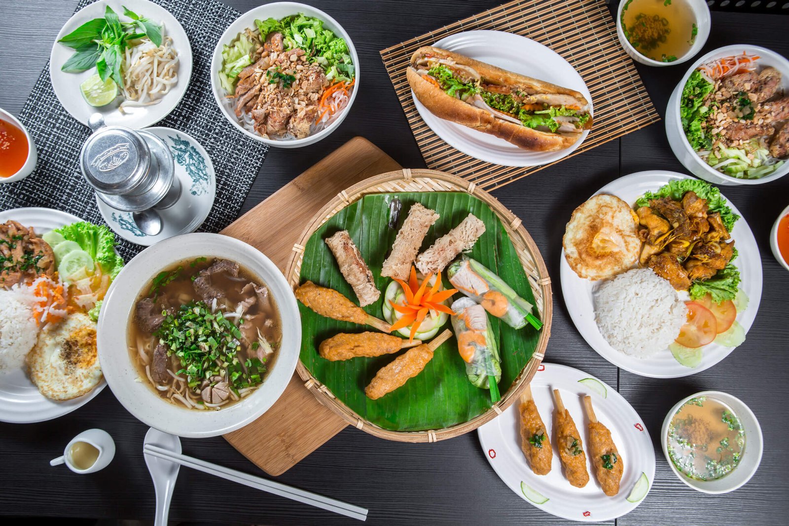 Selection of Michelin-star inspired Vietnamese dishes including pho, banh mi, spring rolls and grilled specialities