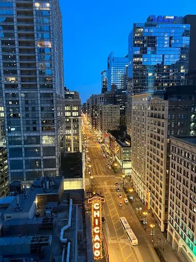 The Chicago Theatre sign on State Street at dusk seen from theWit Chicago