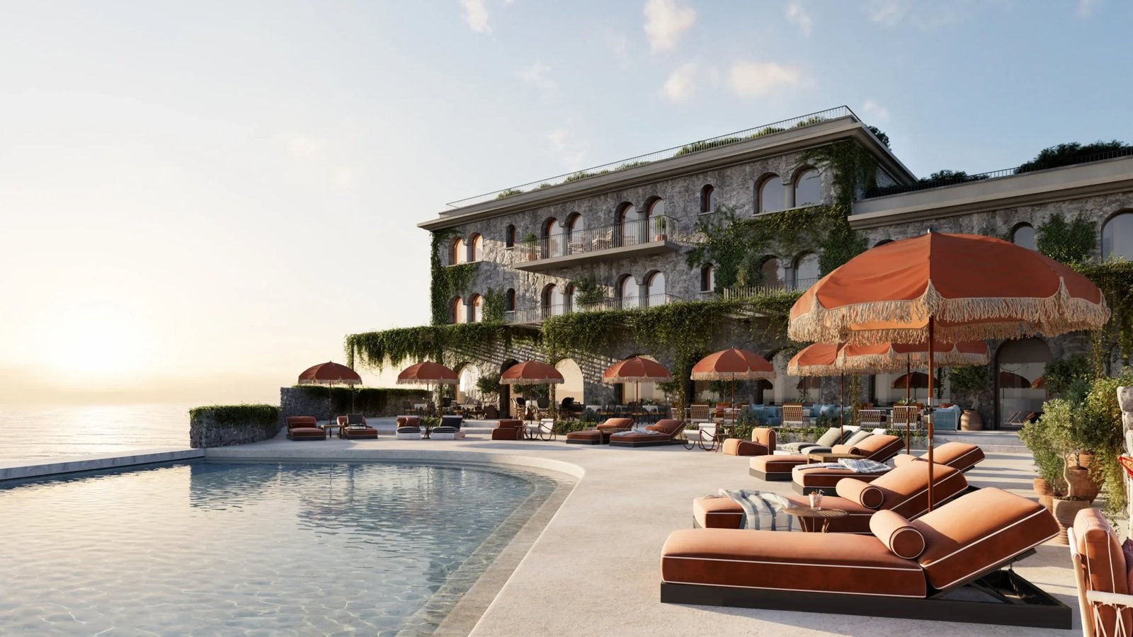 Outdoor pool with sun loungers at Delos, Zannier Île de Bendor, with the Mediterranean beyond
