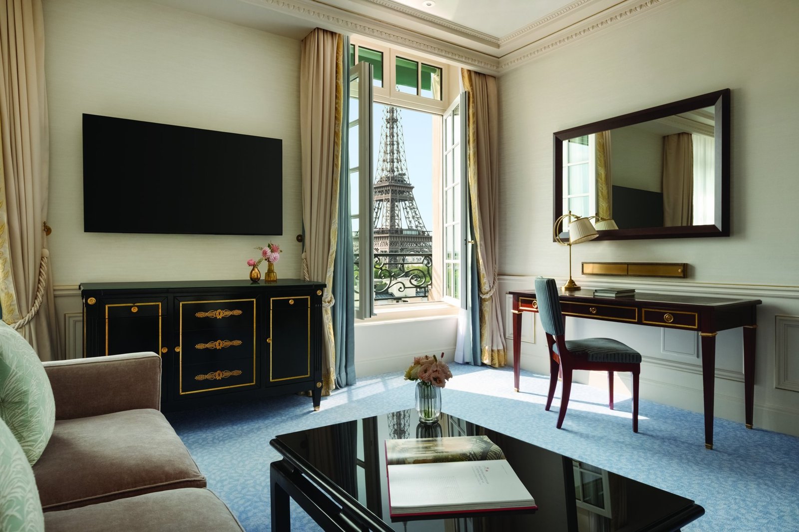 Eiffel View Room at Shangri-La Paris with a blue and ecru bed and a window looking directly at the Eiffel Tower