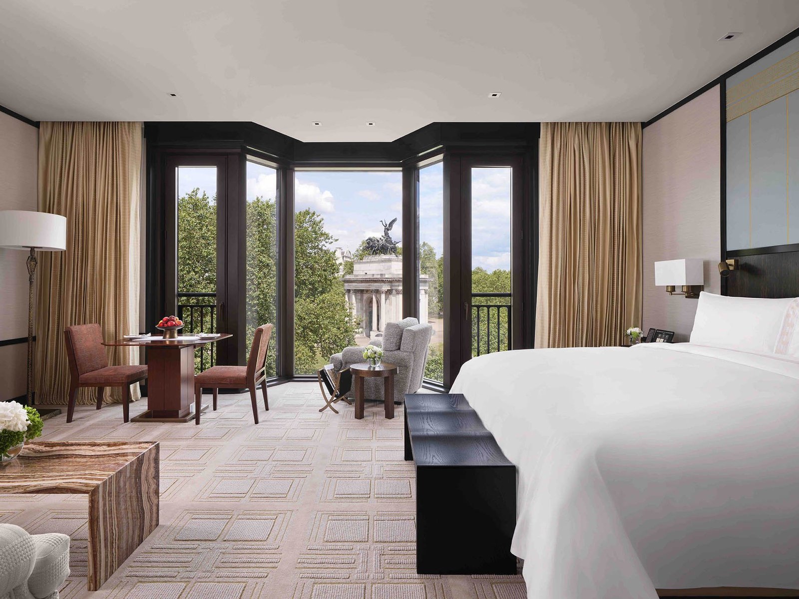Grand Premier Park Room at The Peninsula London with floor-to-ceiling windows looking toward Wellington Arch and Hyde Park Corner