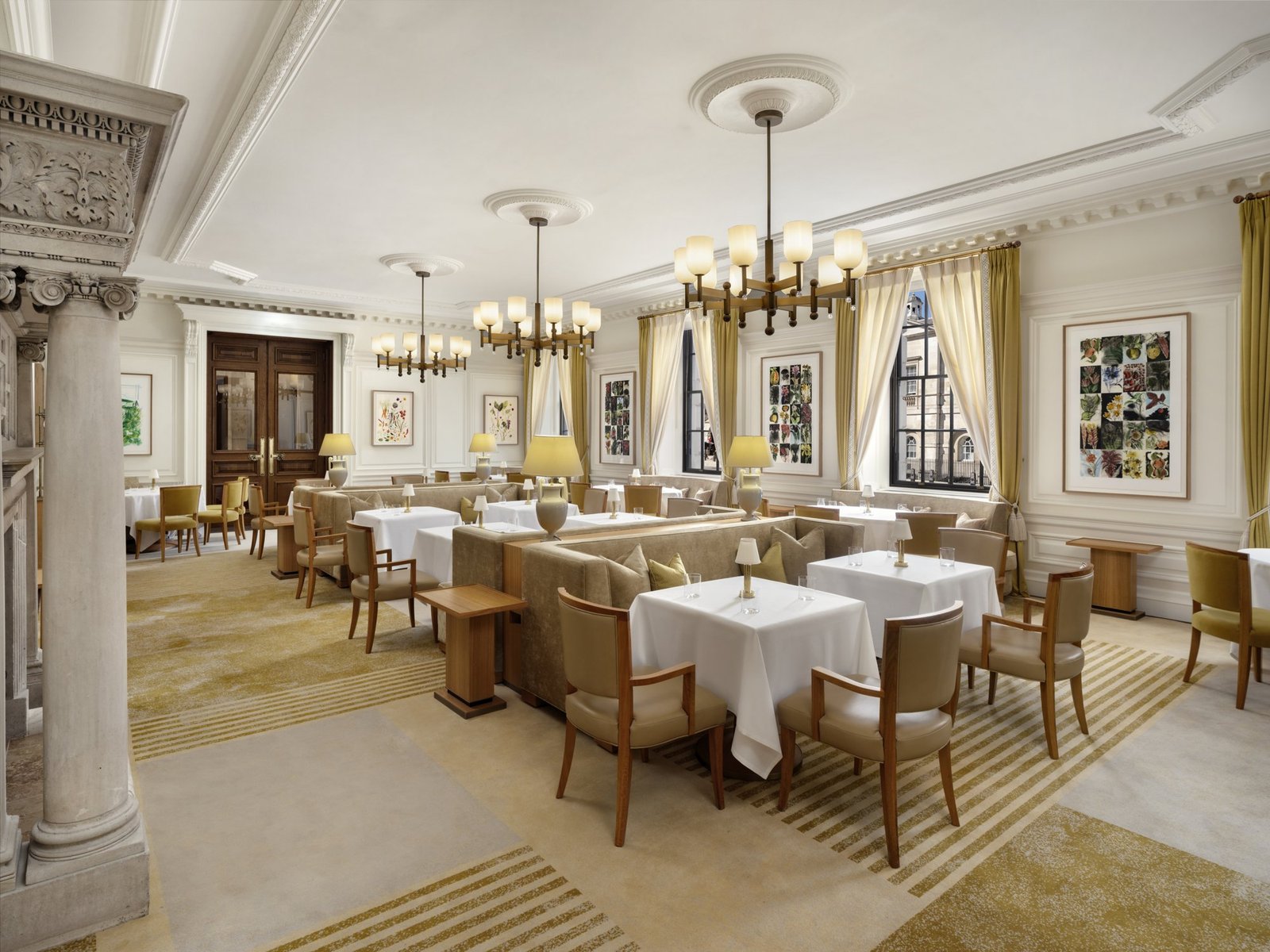 Elegant dining room at Mauro Colagreco at Raffles London at The OWO with set tables beneath high Edwardian ceilings